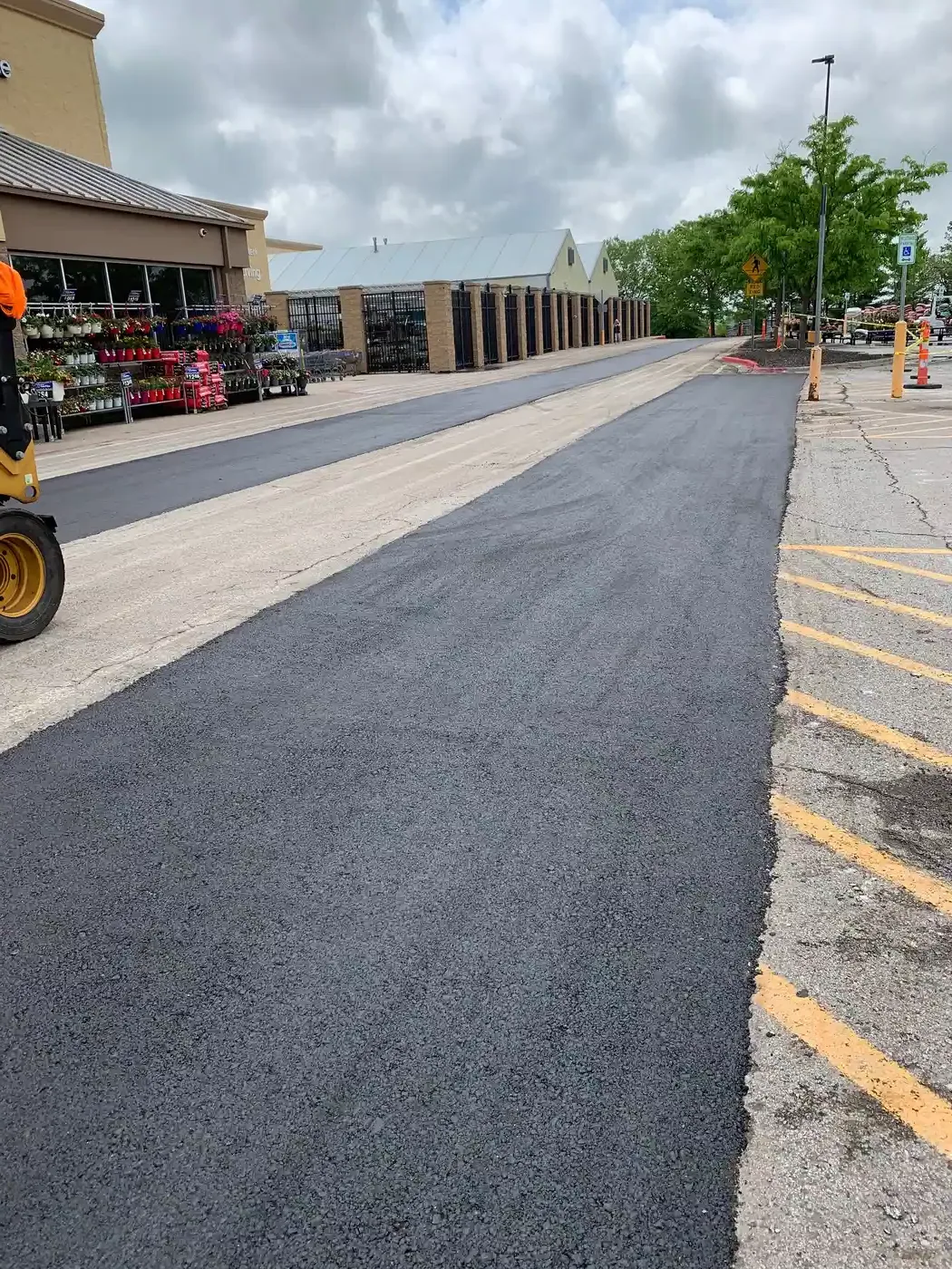 Asphalt resurfacing in Kansas City — fresh overlay contrasted against worn old surface
