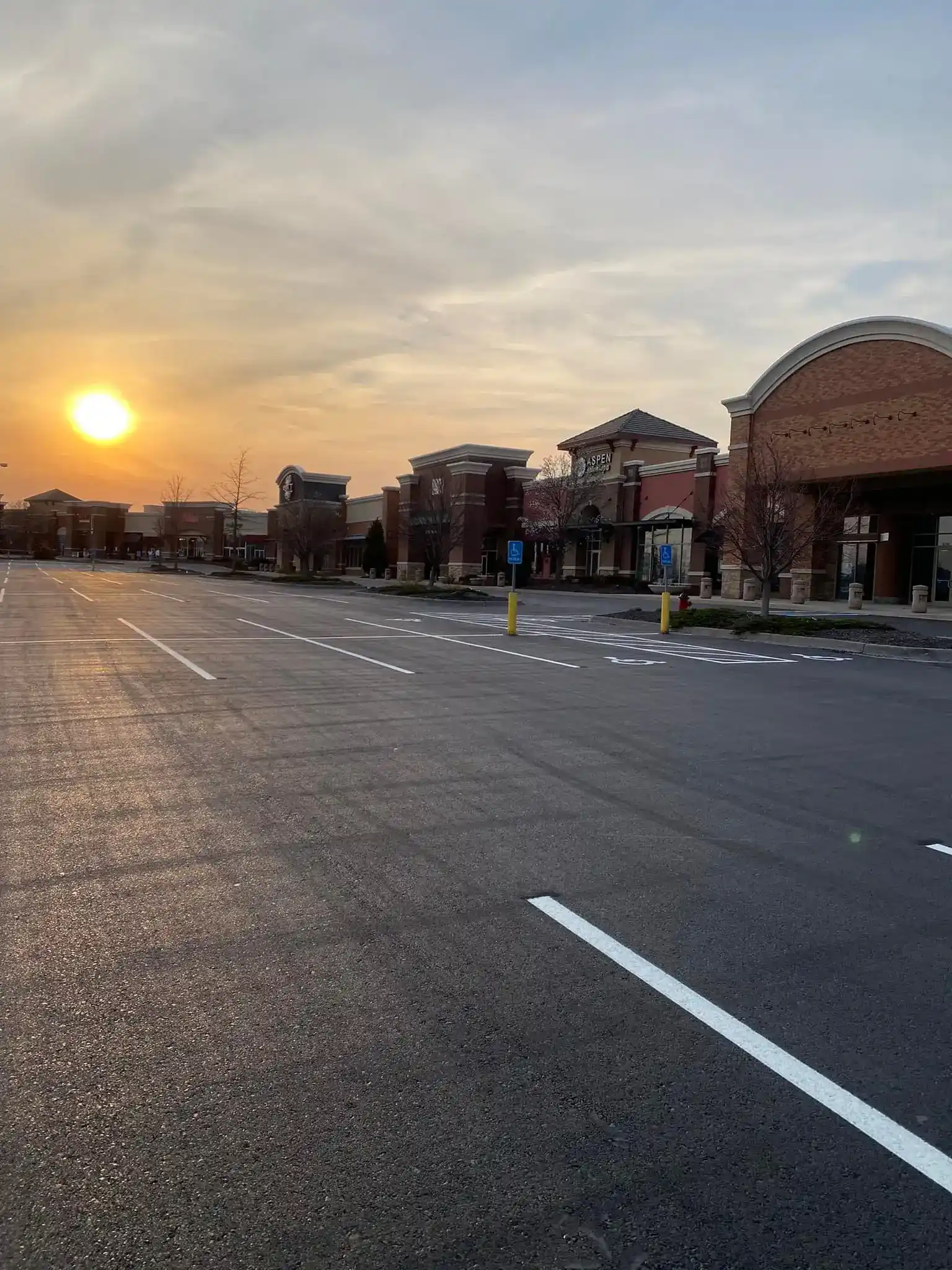 Freshly sealcoated commercial shopping center parking lot in Kansas City