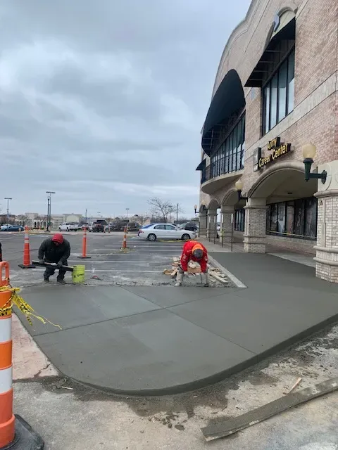 Commercial concrete repair in Kansas City — crew finishing a fresh pour