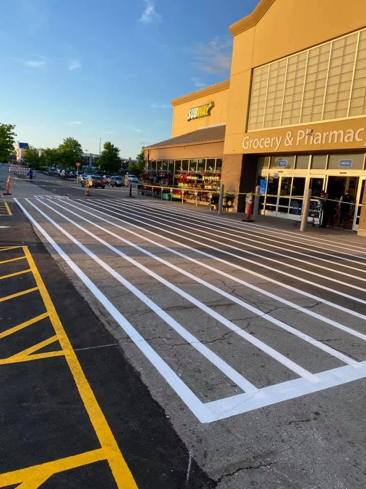 Line striping and pavement marking on a freshly paved Kansas City commercial lot